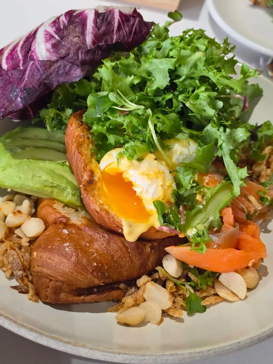 Cross-section of brunch with a burst soft-boiled egg