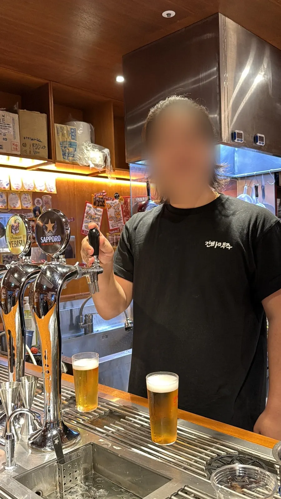 Glass of Sapporo draft beer with a smooth foam layer