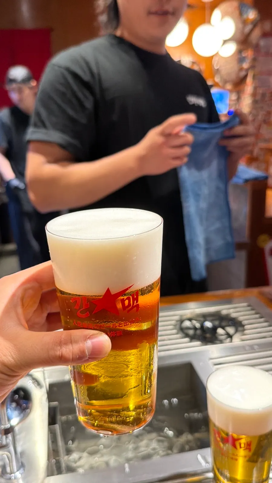 Guests drinking beer while standing