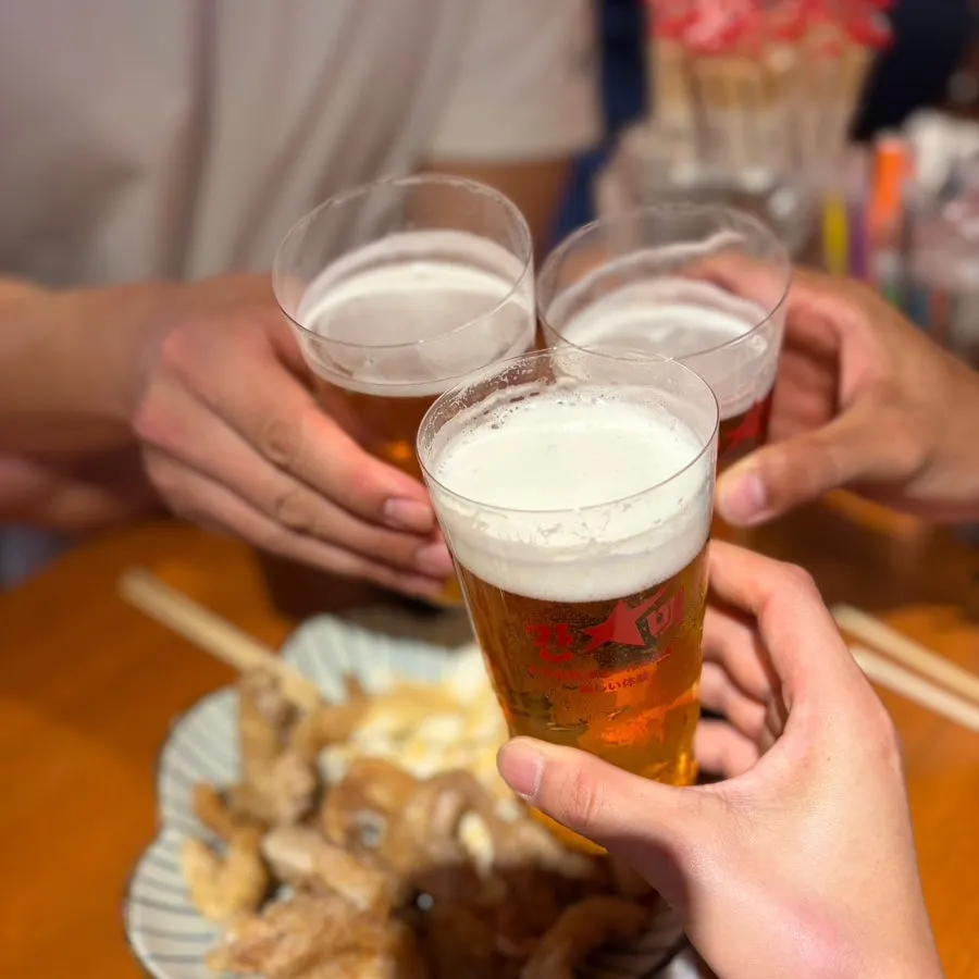 A finished glass of Sapporo draft beer