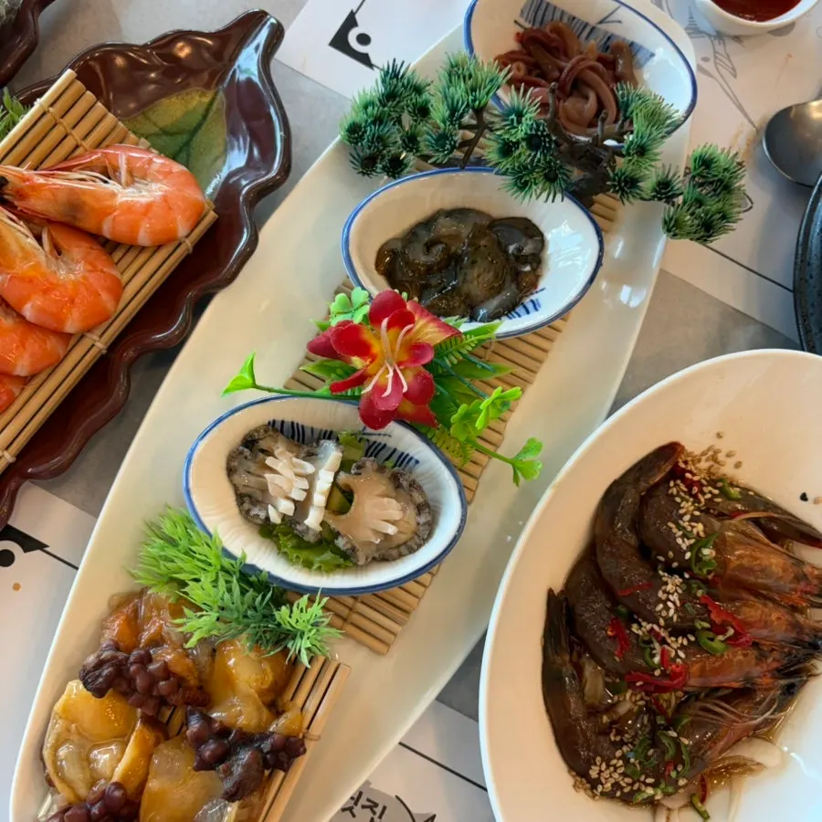 Plated assorted seafood dishes from the suyeon hansang set