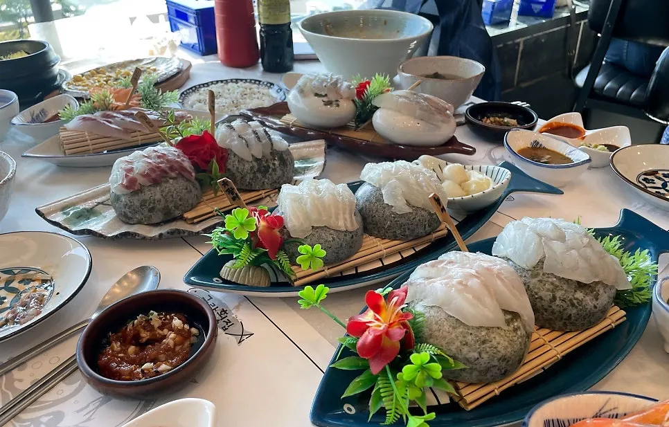 Spread of soy-marinated shrimp, steamed egg, cheese-grilled scallop, and octopus tangtangi