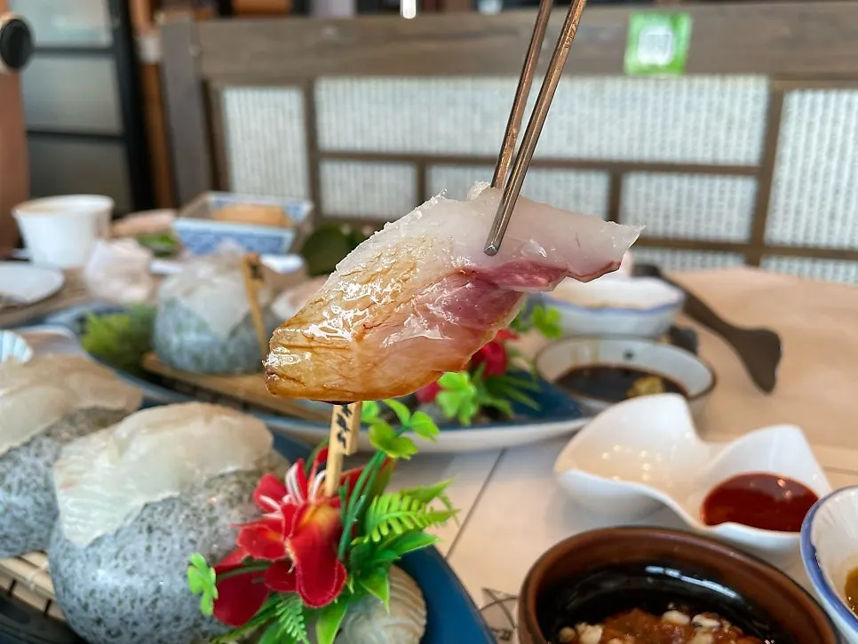 Wild sashimi dipped into gonowada sauce