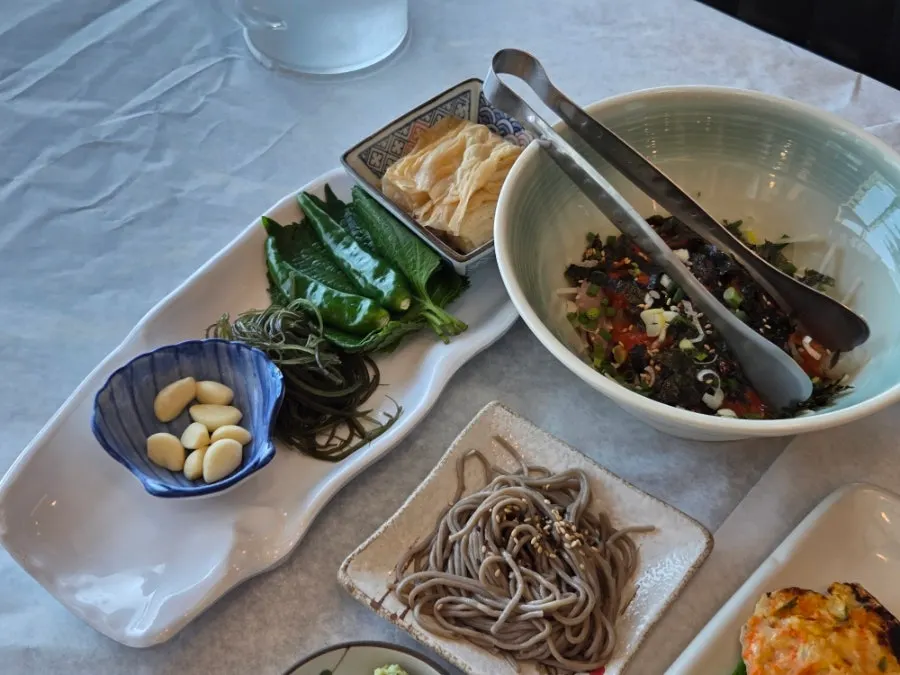 Buttered scallops, soy-marinated shrimp, and other side dishes
