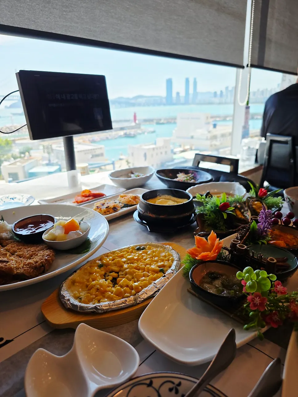 Sukiddasi spread with ocean view outside the window