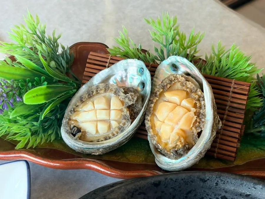 Live octopus, abalone, and salmon salad served next
