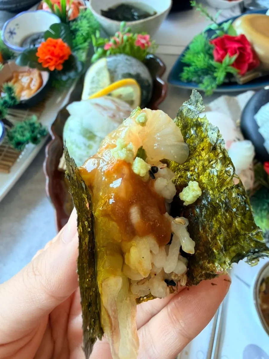 A thick piece of sashimi eaten with aged kimchi