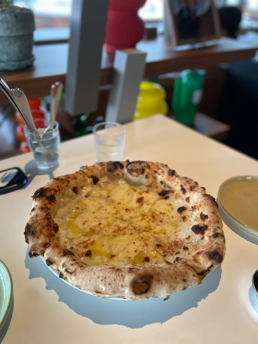 Gorgonzola wood-fired pizza piled high with cheese
