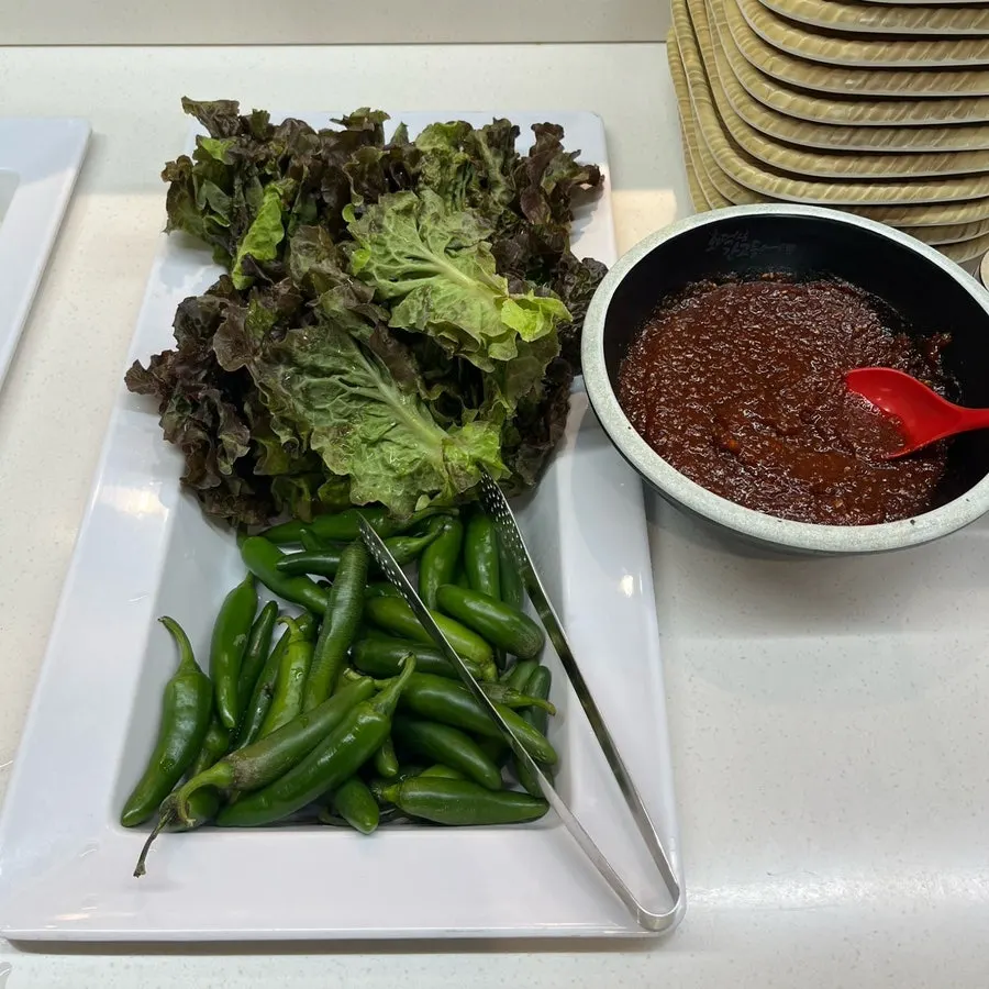 Japchae and seasoned vegetables at the self-serve bar