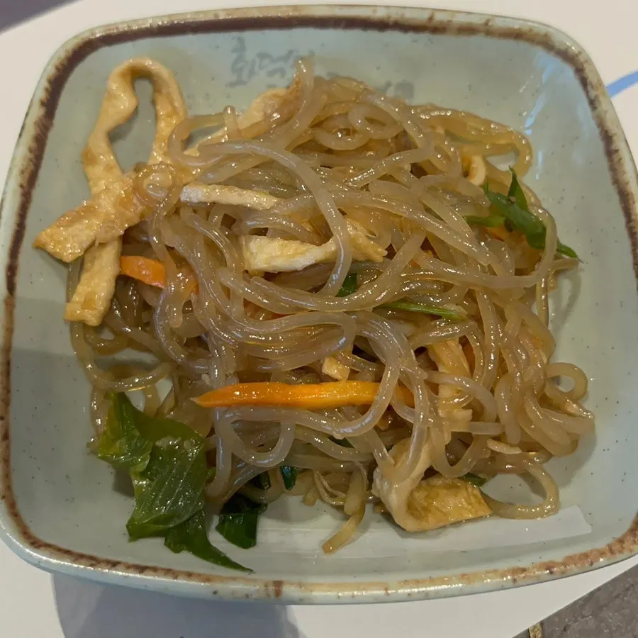 A plate of japchae from the self-serve bar