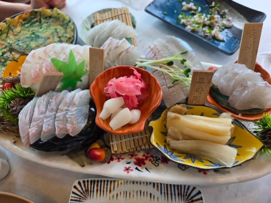 Assorted sashimi plate with wooden name tags