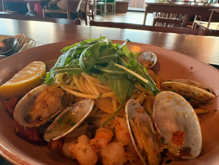 Honey sweet potato pizza and shrimp oil pasta set against the Gwangalli ocean view