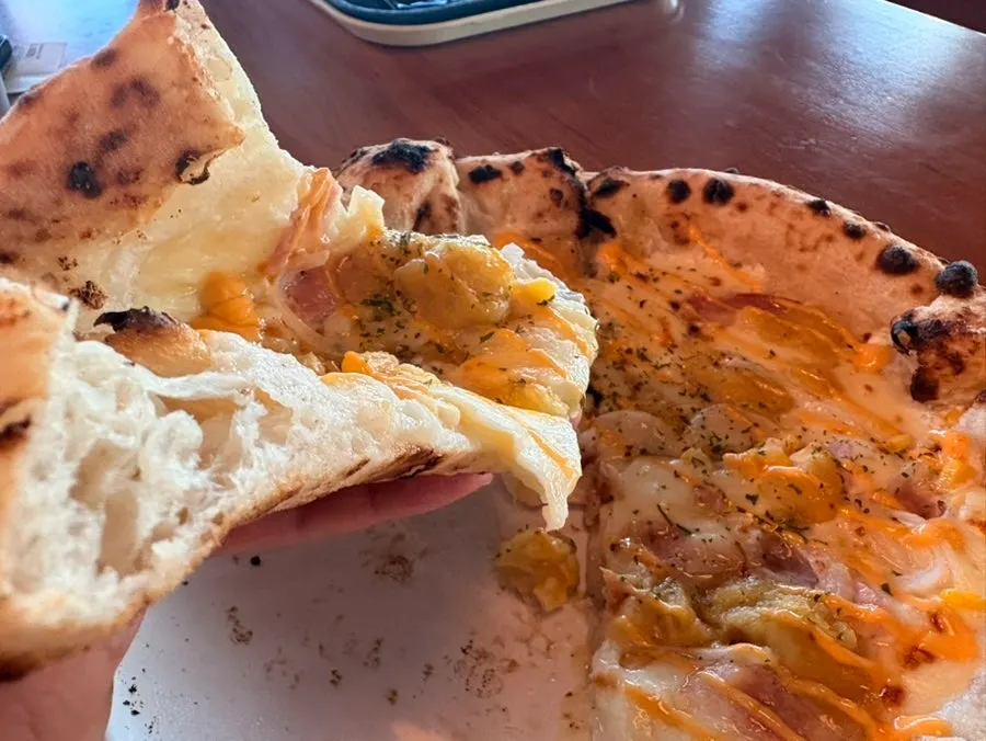 Pizza slice topped with sweet potato