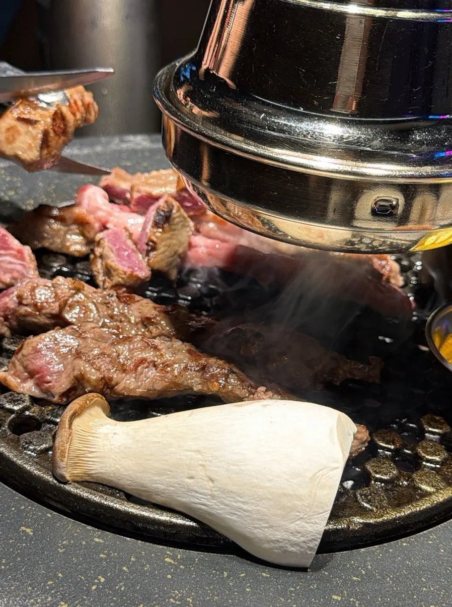 Pork grilled by a staff member