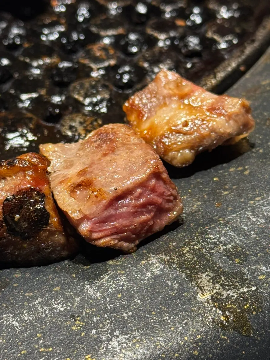 Meat grilling over Baekran charcoal