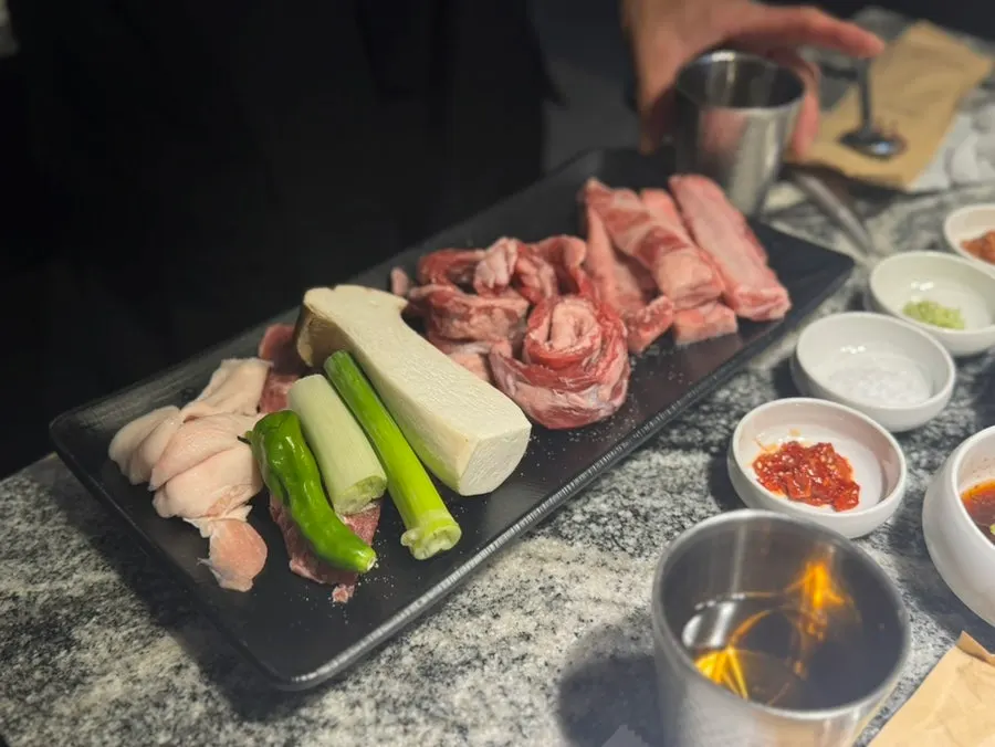 Charcoal heating up with sides alongside
