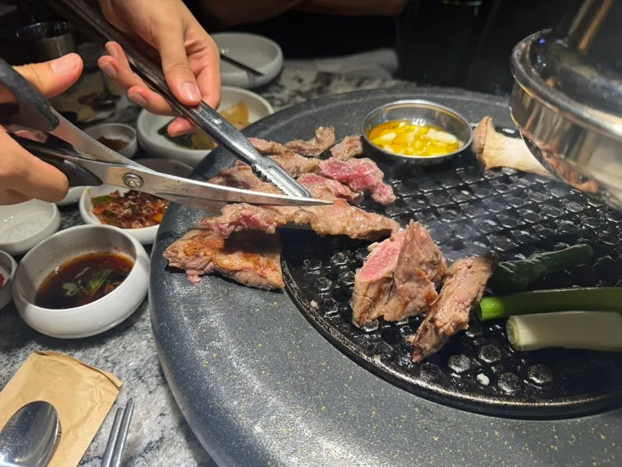 Meat and vegetables placed on the grill