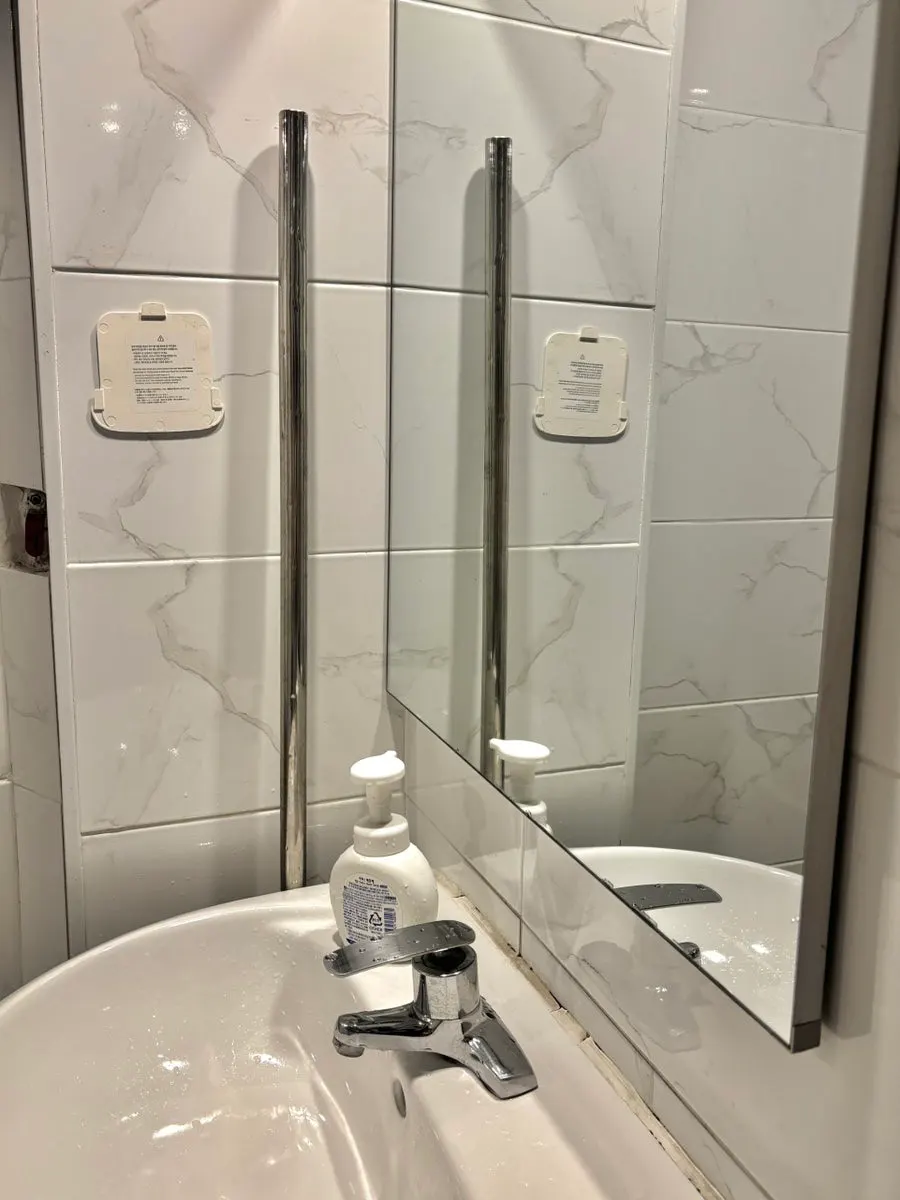 Sink with hand sanitizer in the bathroom