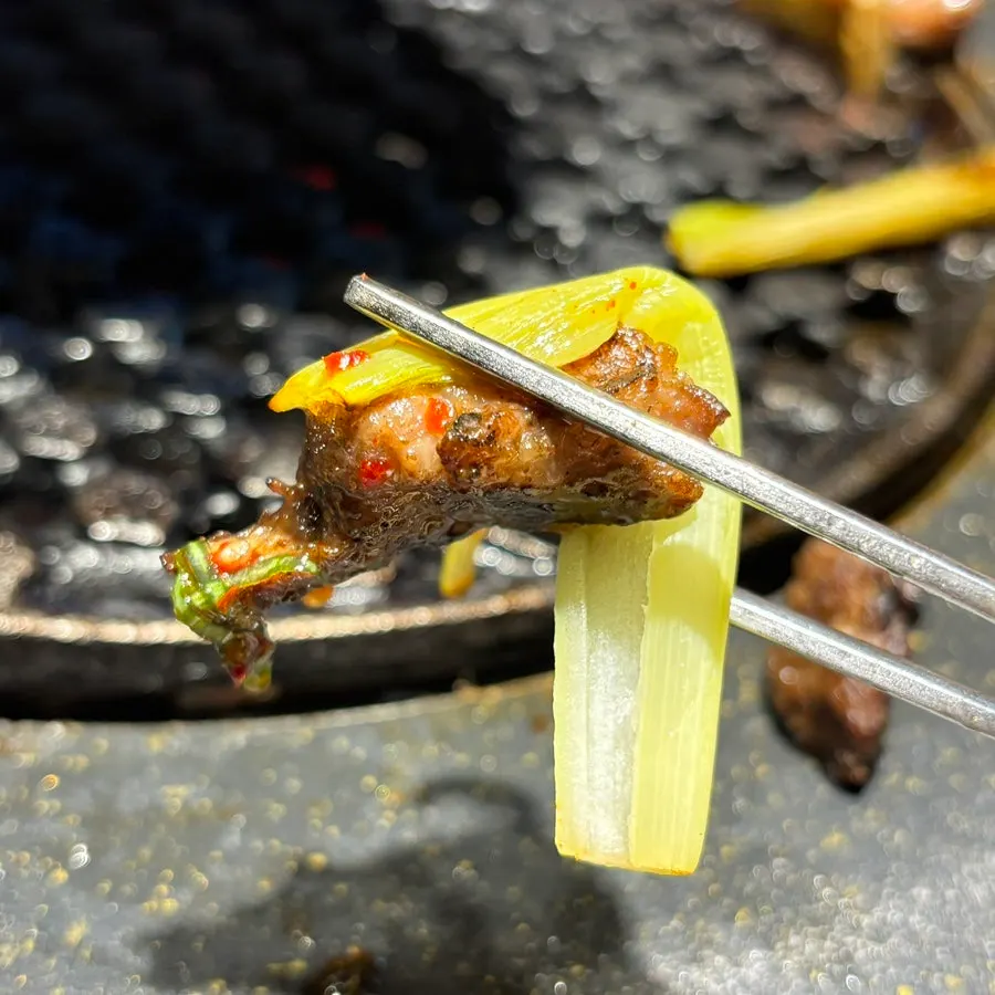 A piece of pluma dipped in Maldon salt