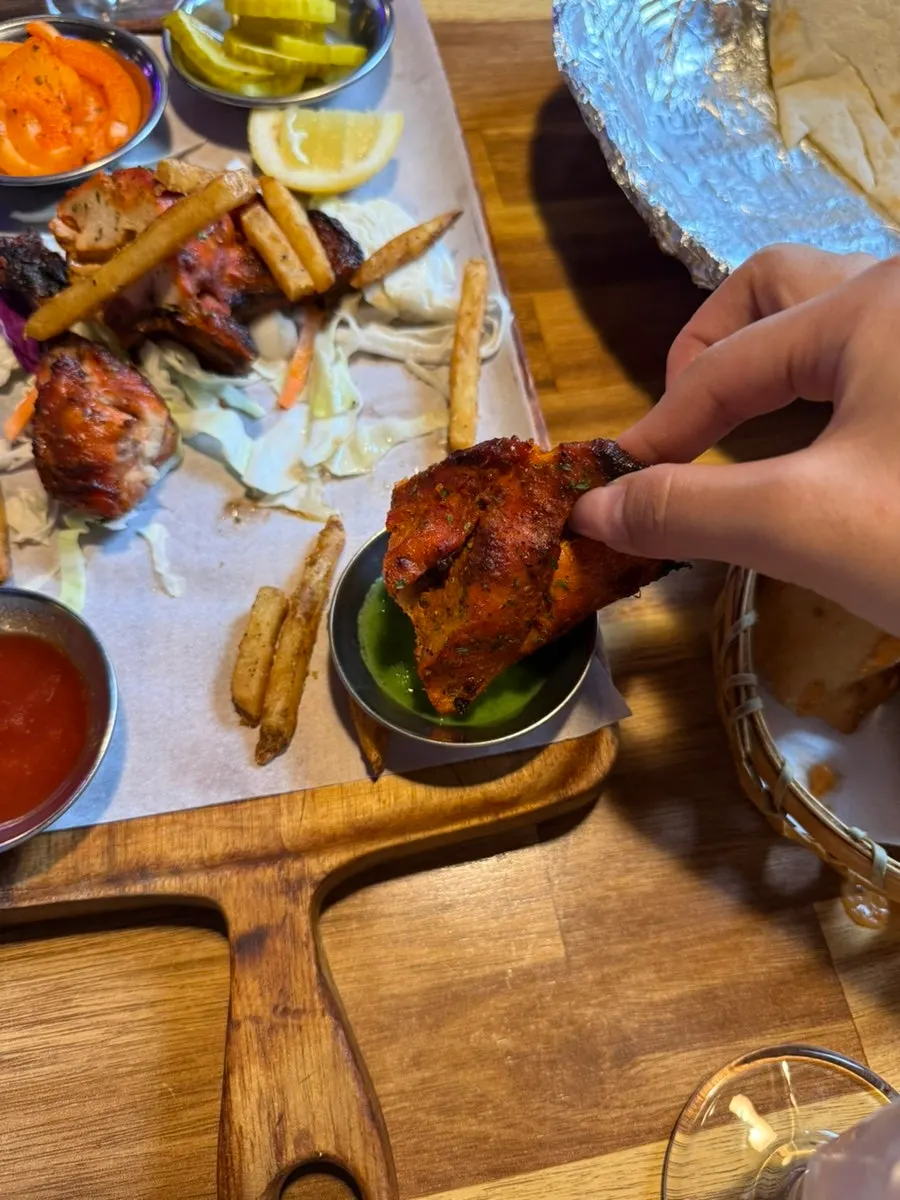 Cross-section of a bitten piece of tandoori chicken