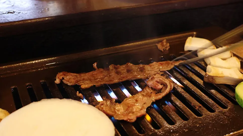 Premium sirloin and pork belly grilled over charcoal