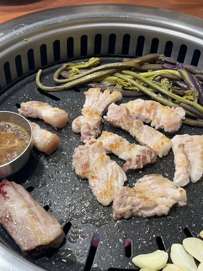 Plate of pink-red Jeju raw ribs and pork belly