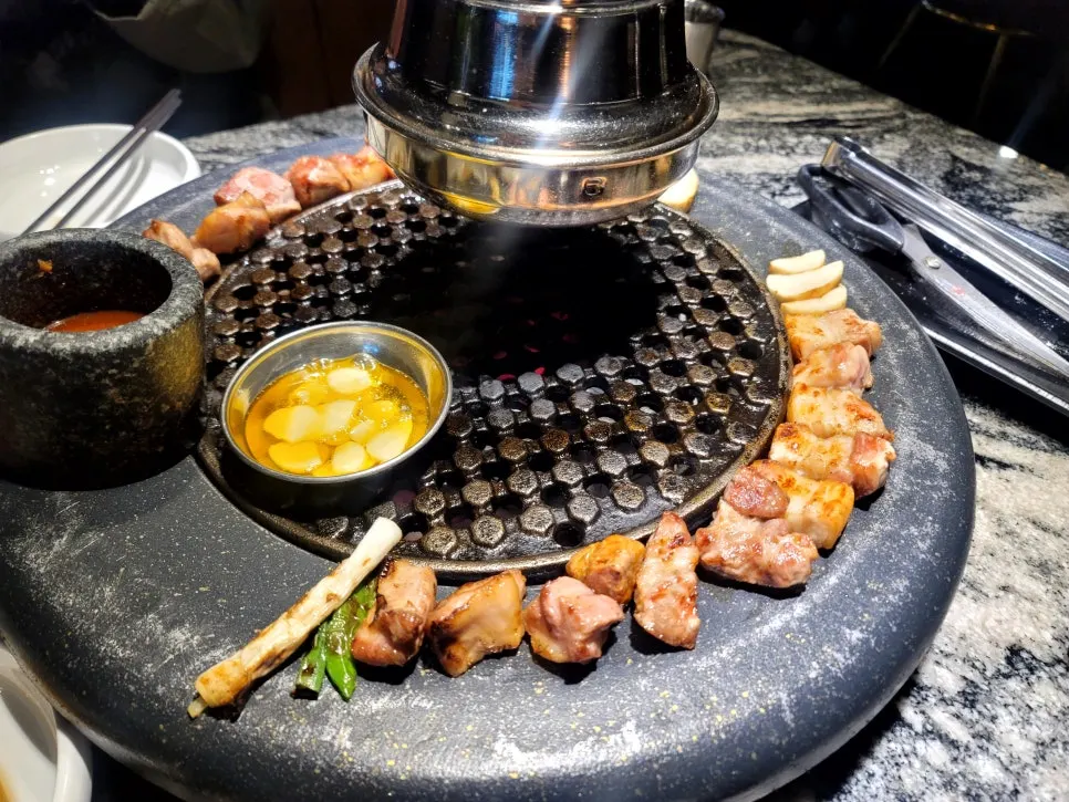 Fully grilled meat moved to the edge of the grill