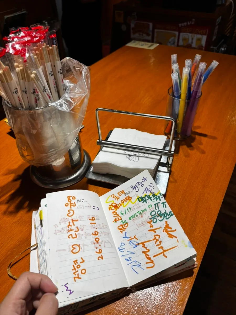 Markers and guestbook notebook on the table