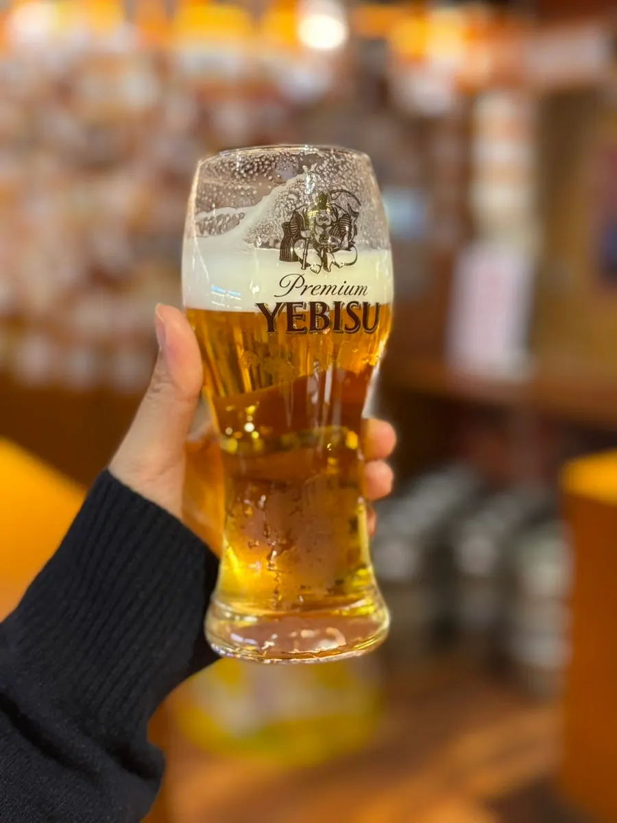 Close-up of a glass of Ebisu draft beer