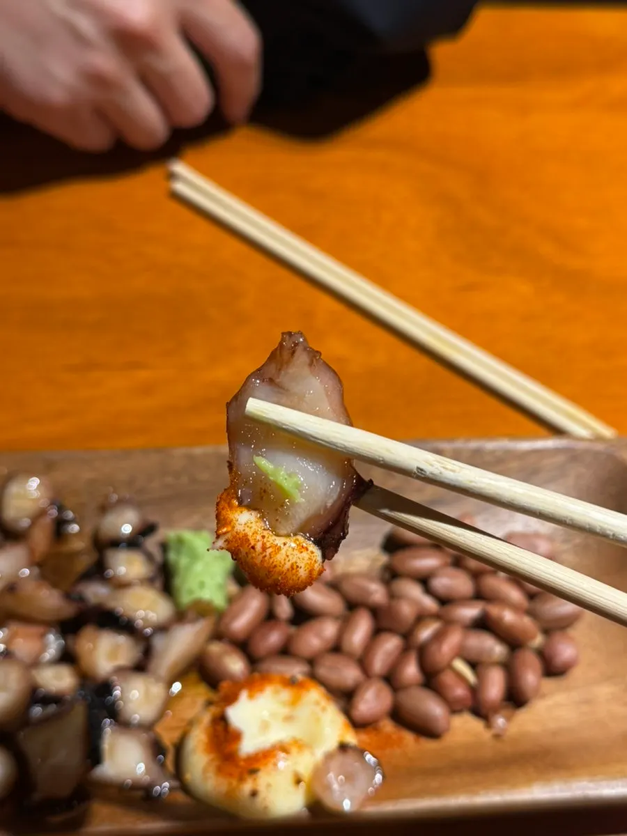 Wasabi and peanuts served with butter octopus