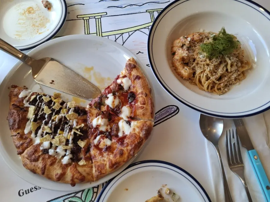 Birria Taco pizza with nachos and cilantro