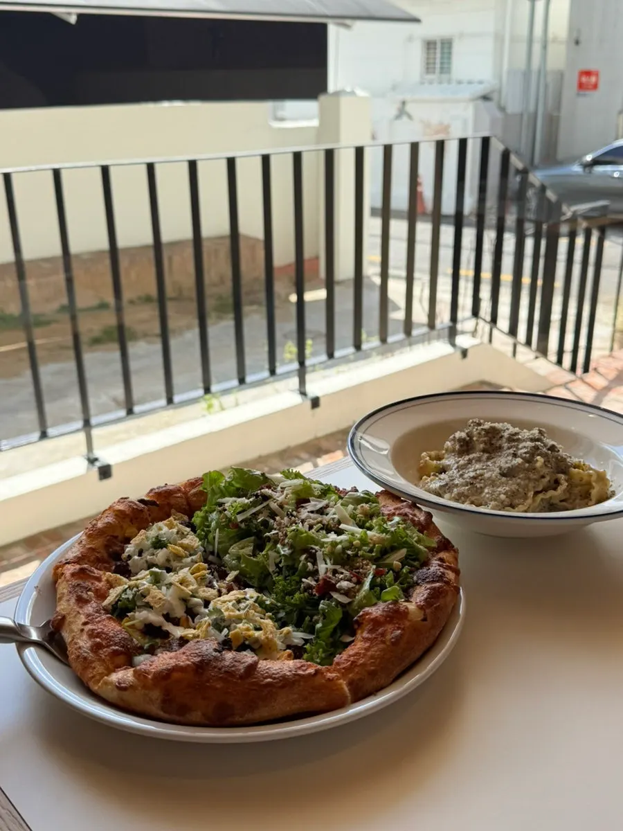 Half salad pizza and half taco pizza