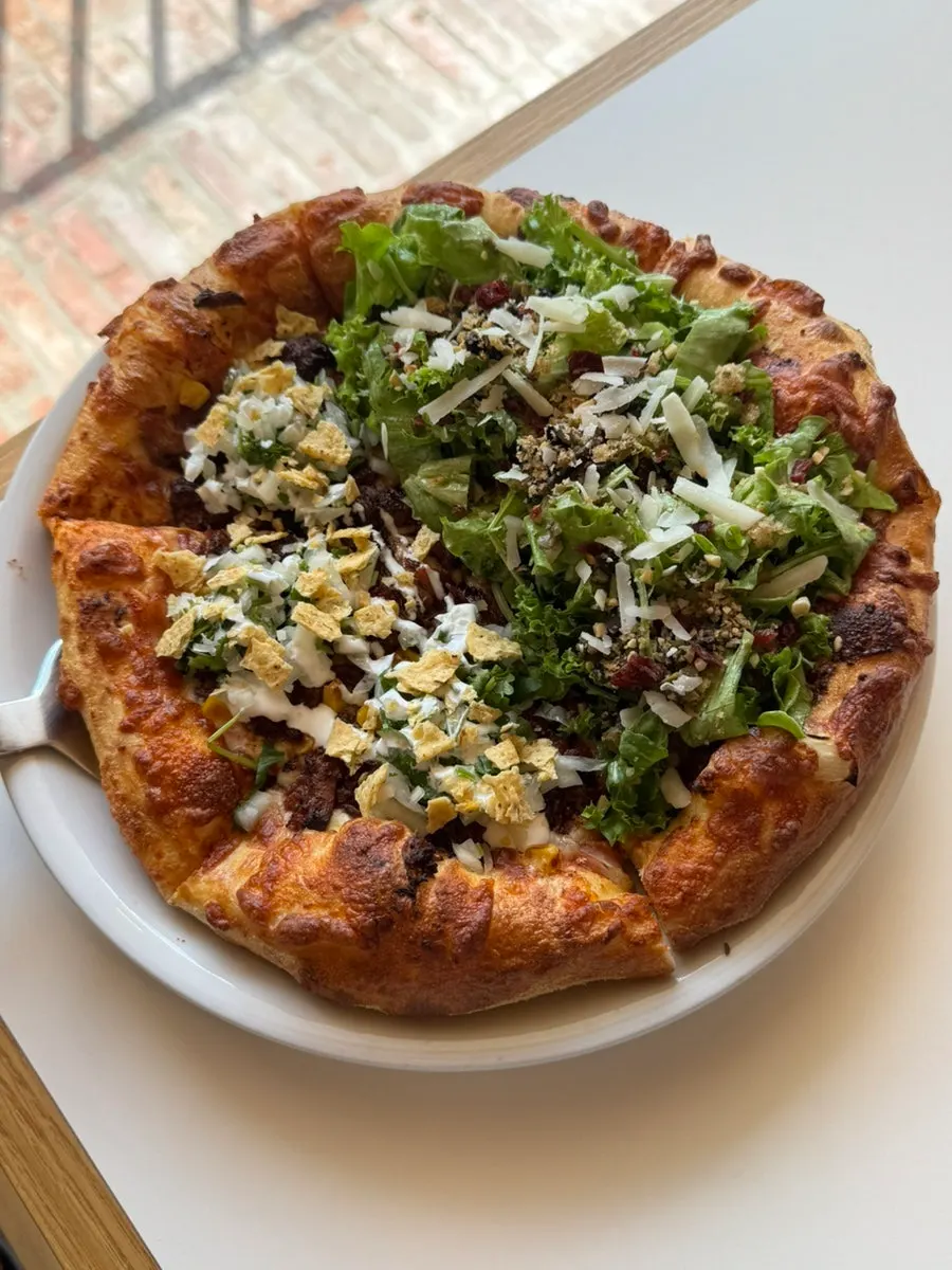 Half-and-half pizza served in three slices of each flavor