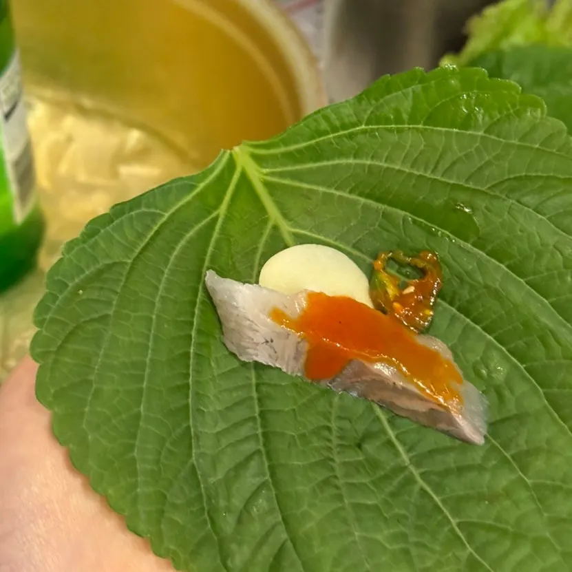 Sashimi wrapped in a perilla leaf