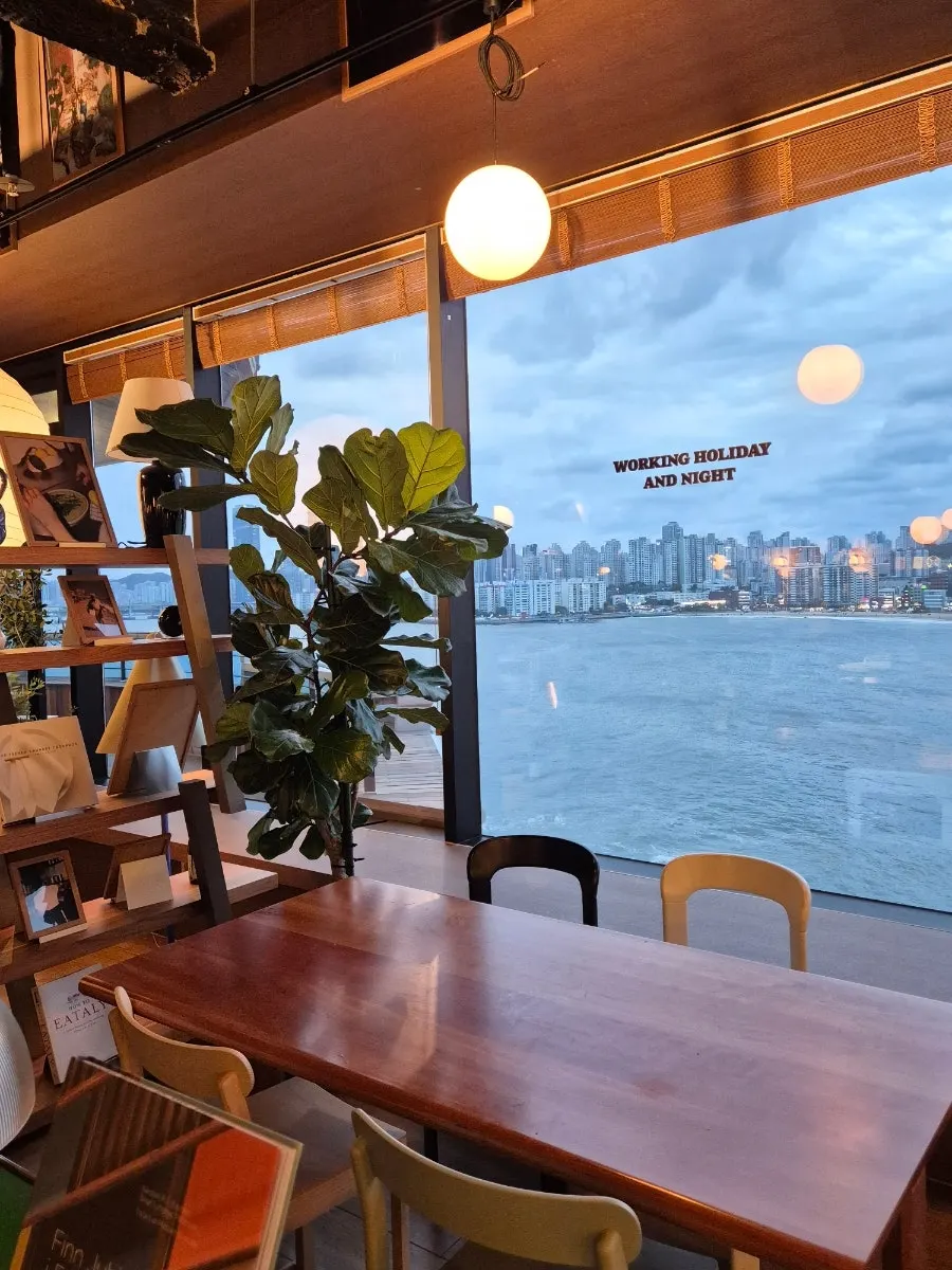 Panoramic view of Gwangalli beach through the floor-to-ceiling windows