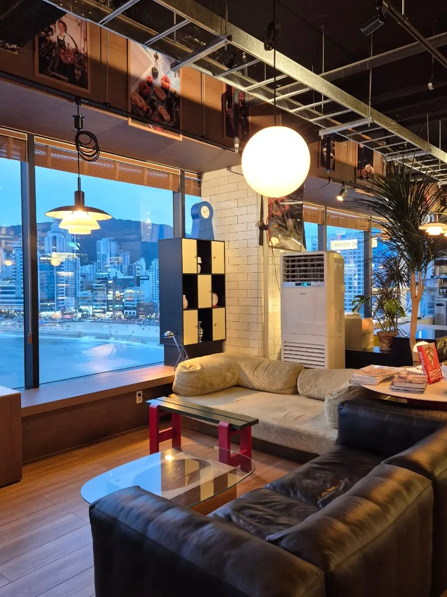 Comfortable sofa seating by the ocean-view windows