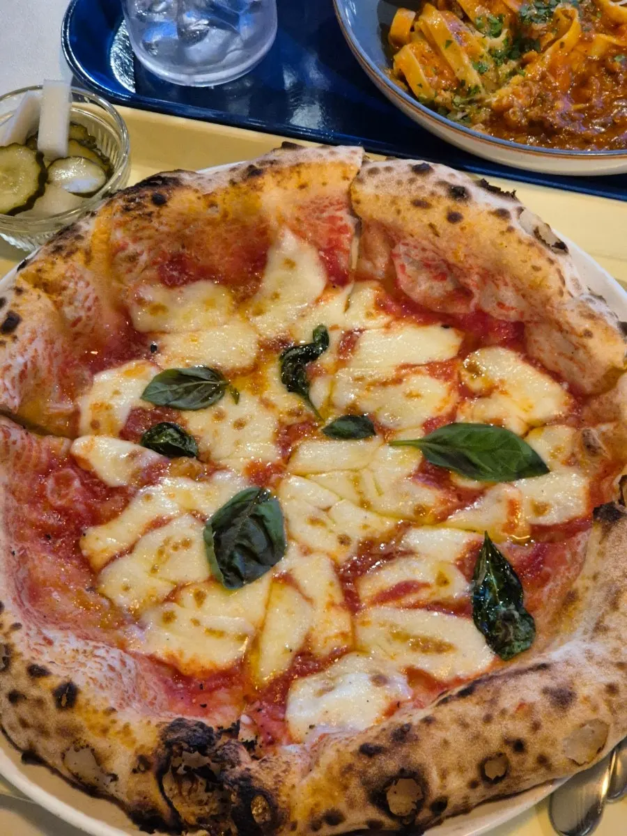 Margherita pizza topped with basil
