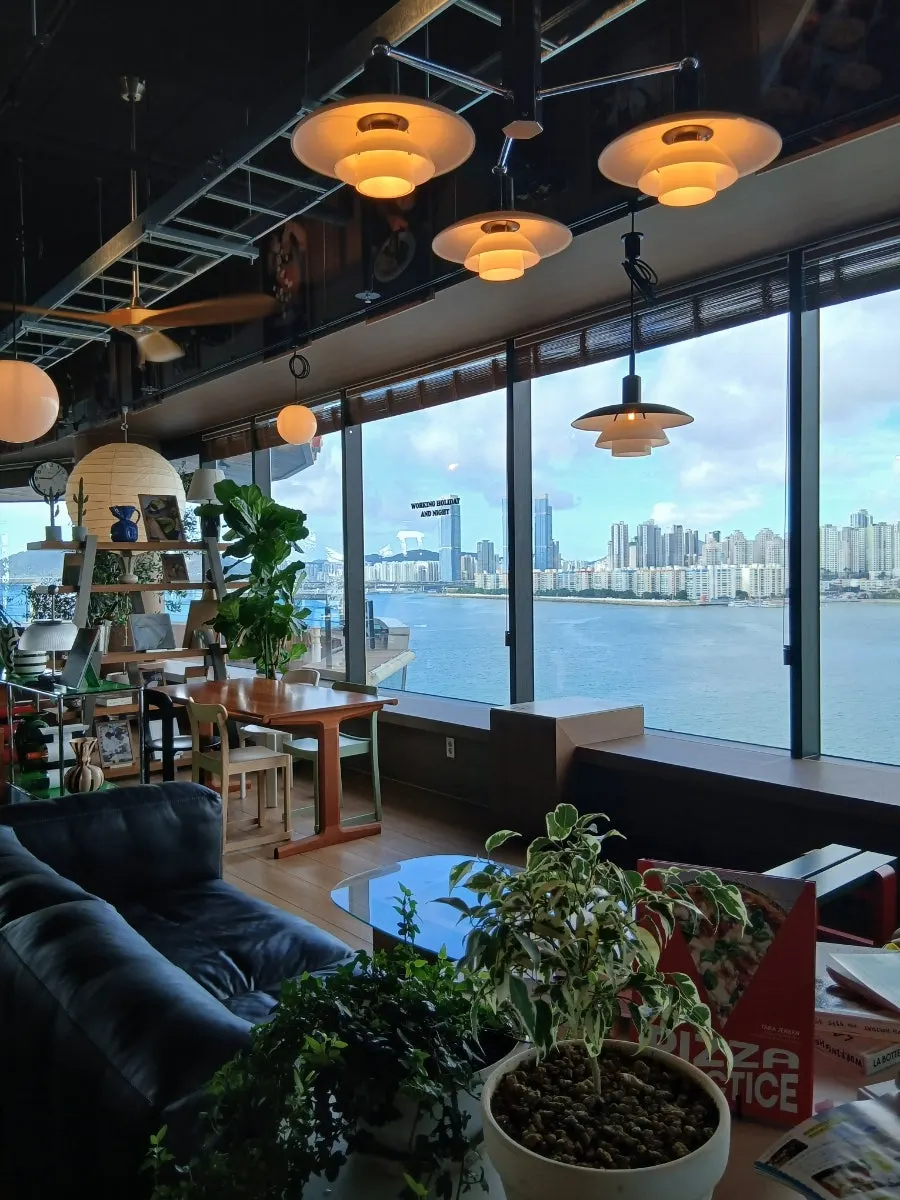 Gwangan Bridge view through two-sided floor-to-ceiling windows