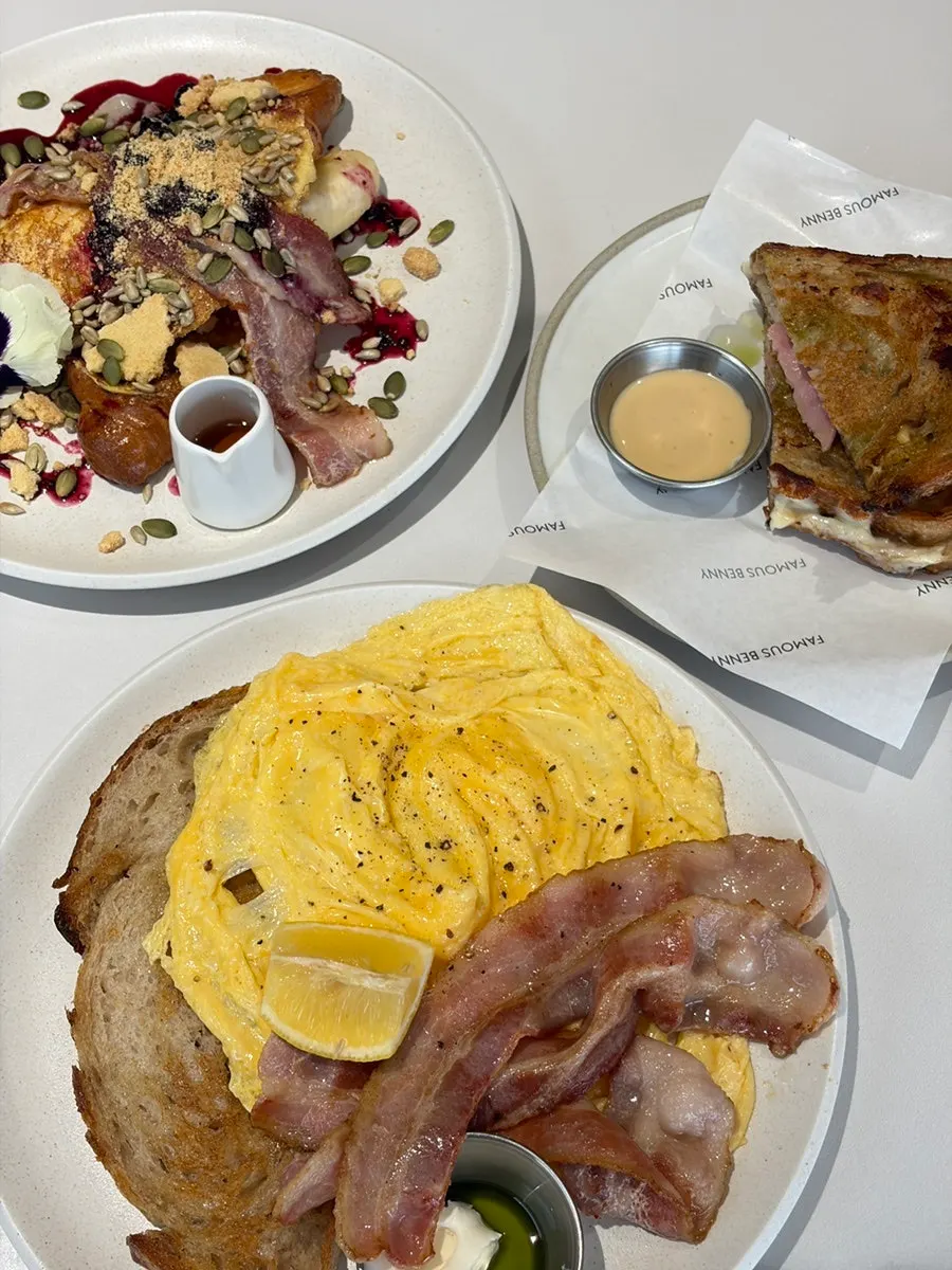 A table set with three types of toast and drinks