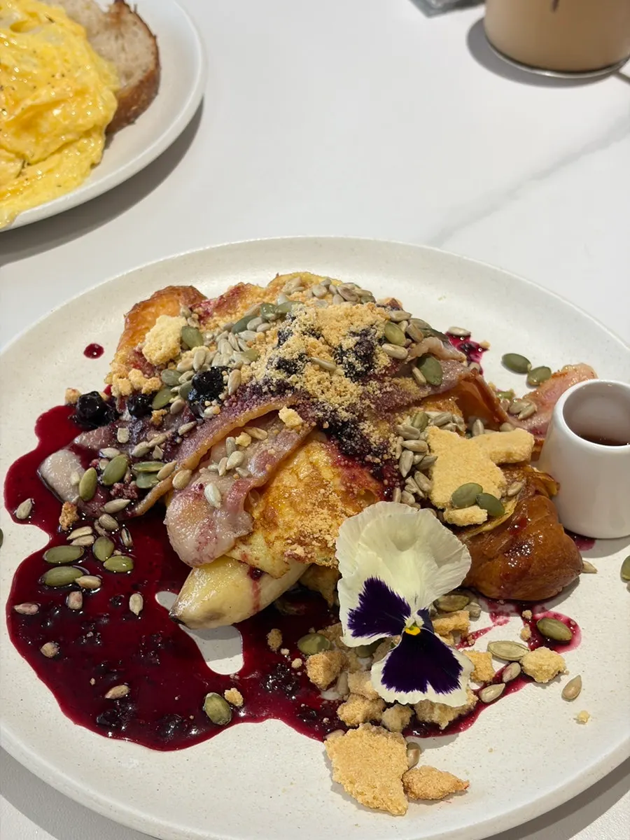 A close-up of French toast piled high on the plate