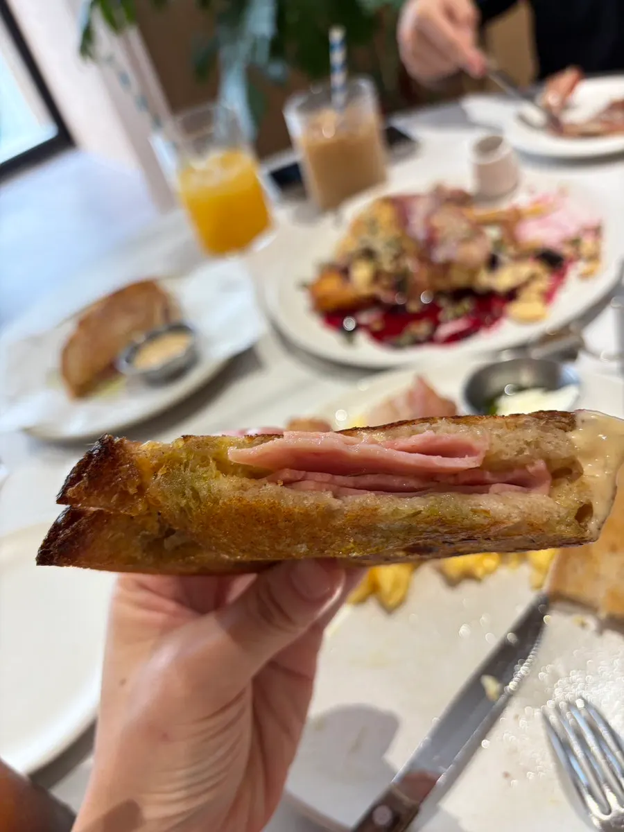 A cross-section of the toast showing ham and cheese