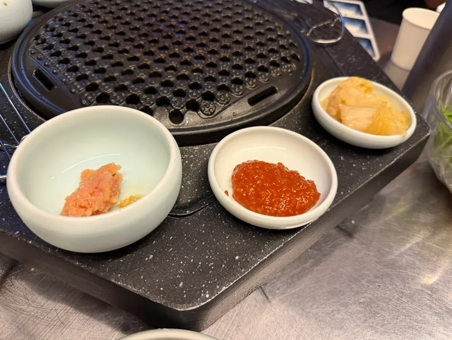 Neatly arranged side dishes for the meat