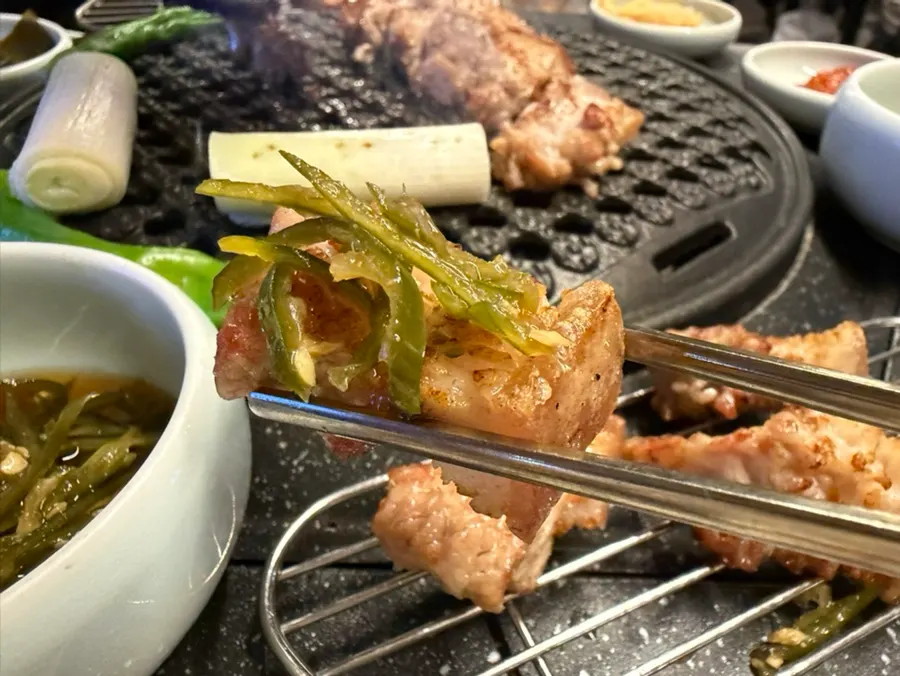 Fire-kissed ogeopsal with myeongran rice at Donbegi Gwang-an Branch