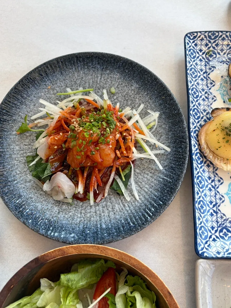 Gaebul, sea cucumber, live octopus, and a seafood spread