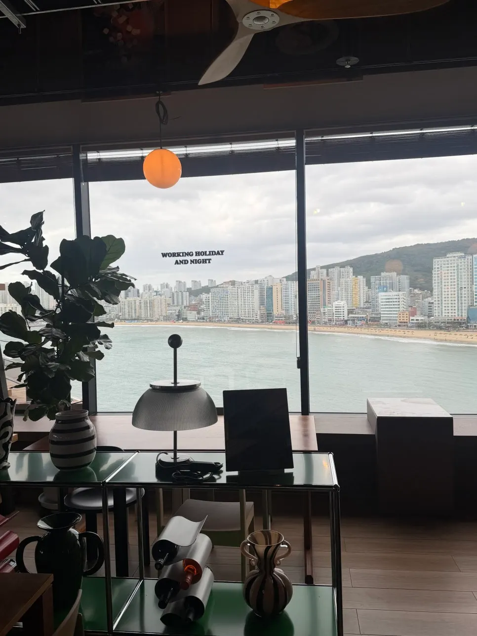 A cup of coffee with the Gwangalli sea in the background