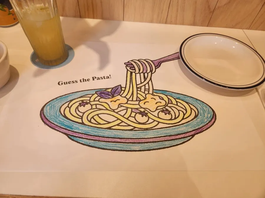 Coloring paper on top of the bar table at Extra Mile