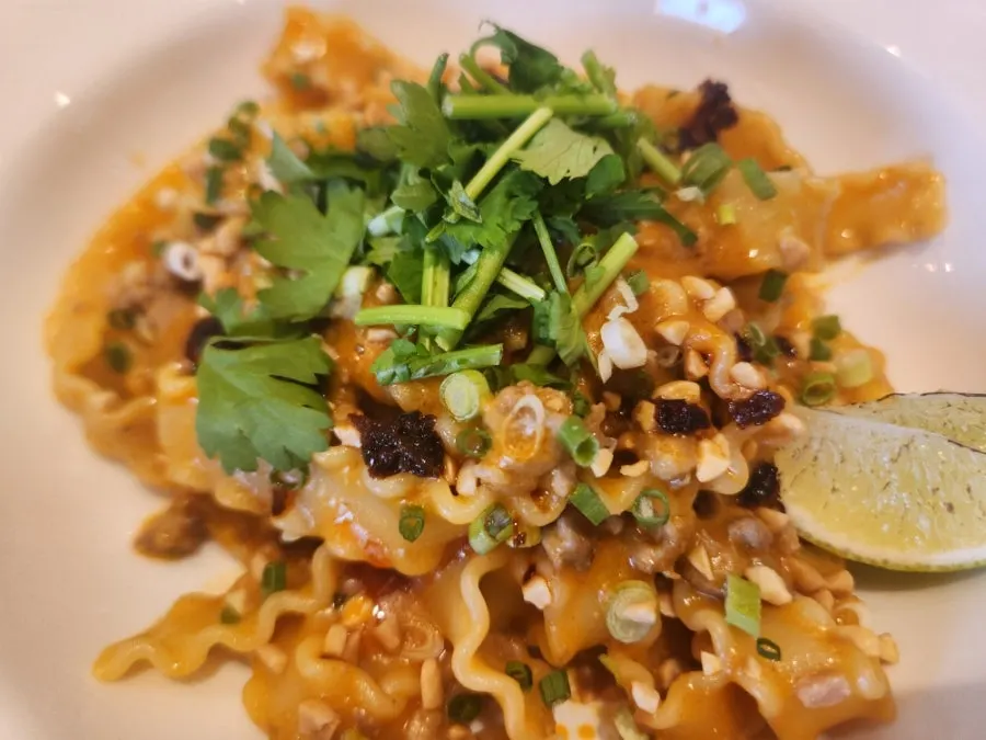 Extra Mile's peanut butter pasta topped with cilantro