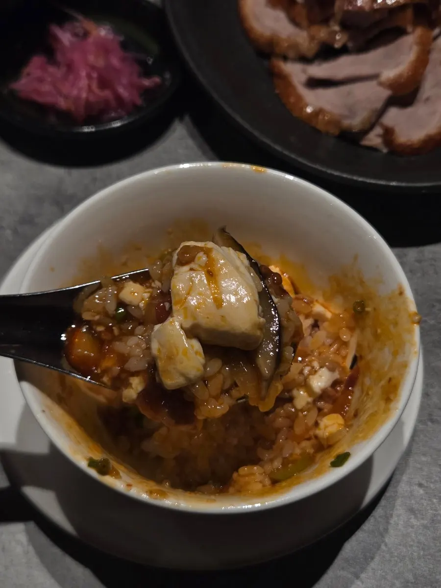 Mapo tofu spooned over rice