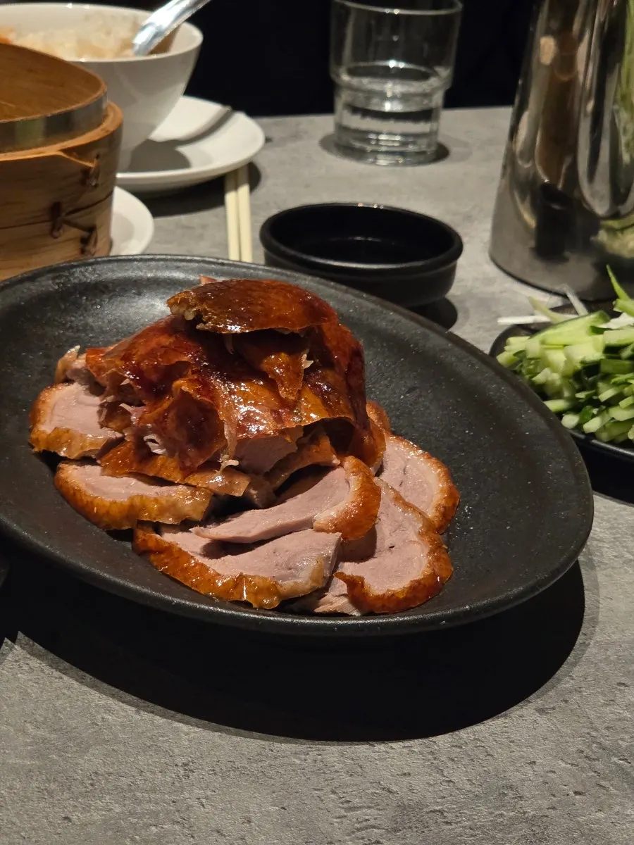 Duck meat and crispy duck skin plated