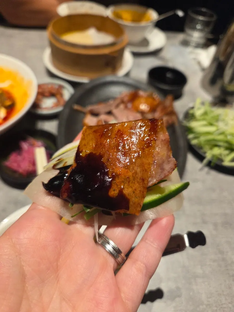 A spread of Peking duck and mapo tofu on the table